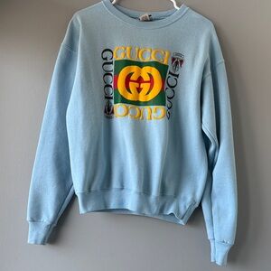 Light Blue Sweatshirt with Yellow & Green Logo